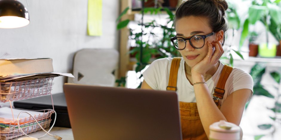 woman sitting at home working on a computer