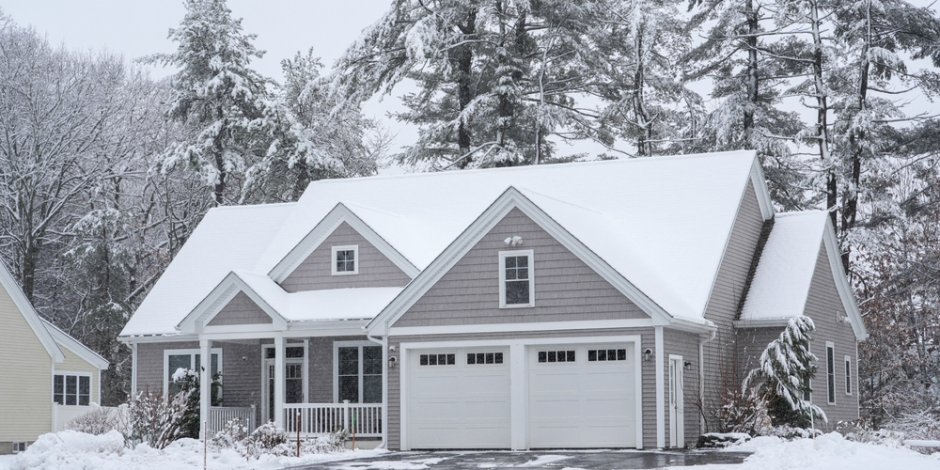 houses in residential community after snow in winter
