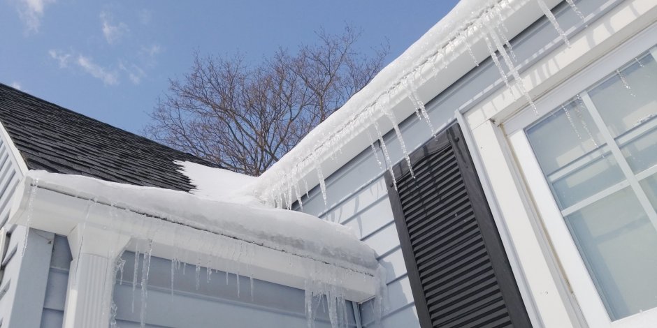 Ice damns forming on the outside of a house