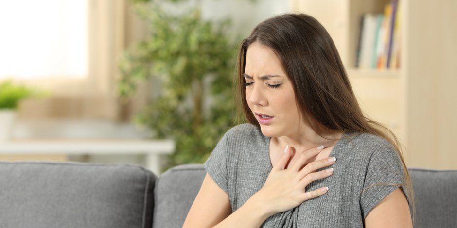 woman at home uncomfortable